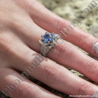 Ocean Blue Sapphire Flower Ring on the Finger